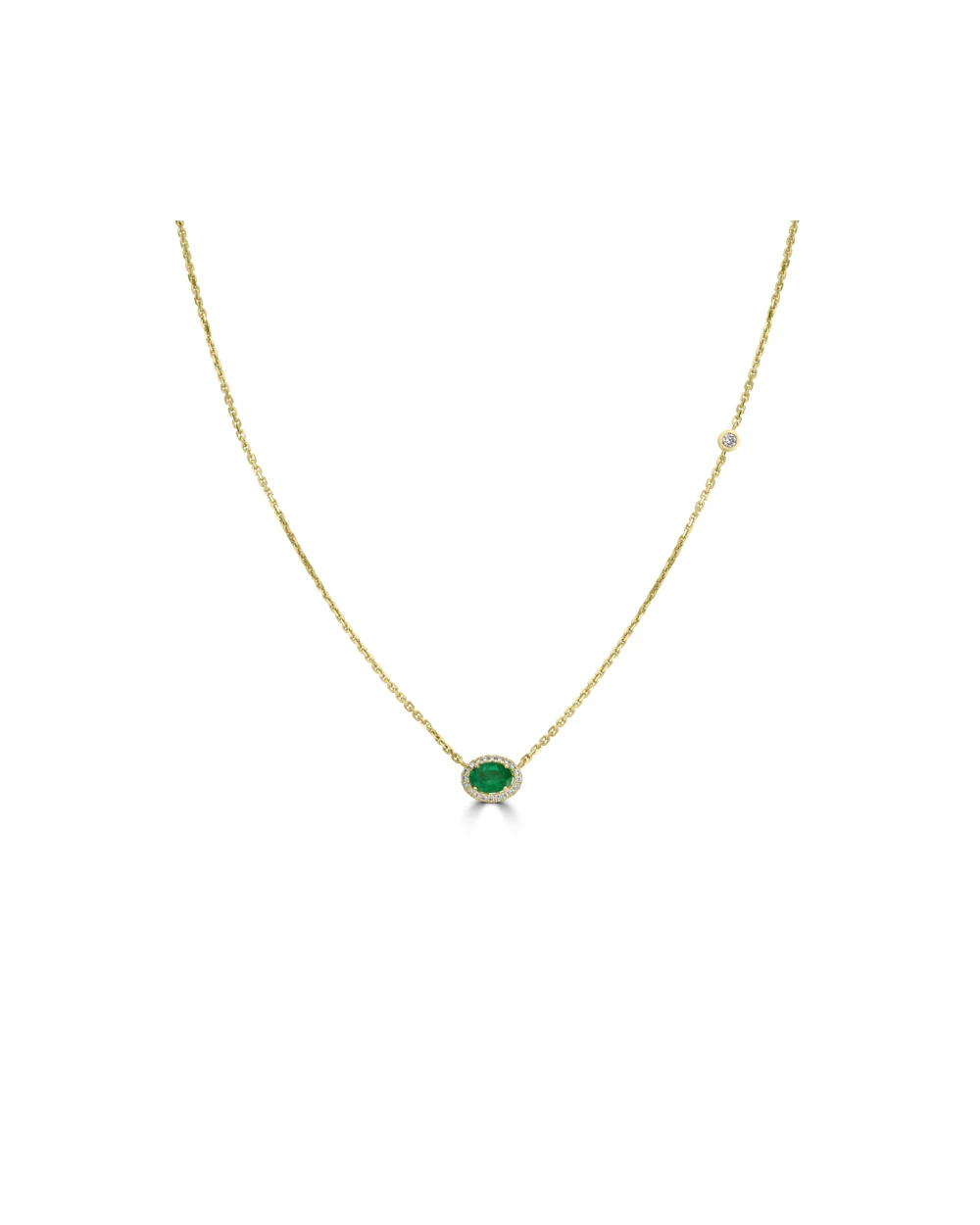 Gold necklace with a green gemstone and diamond centerpiece