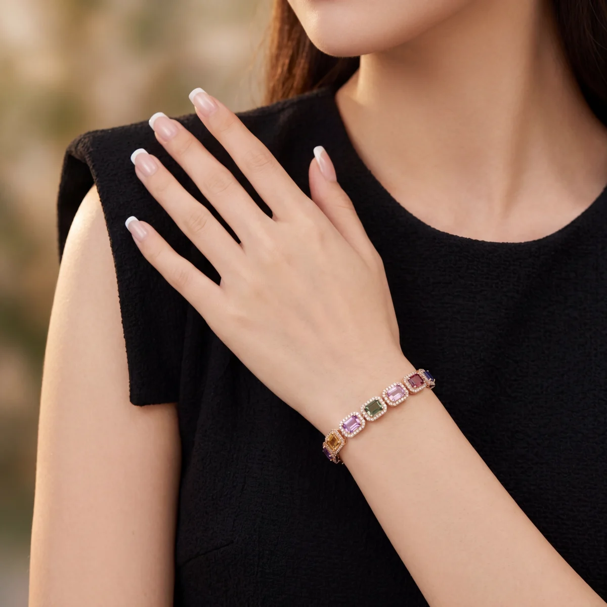 Woman wearing a multicolored gemstone bracelet