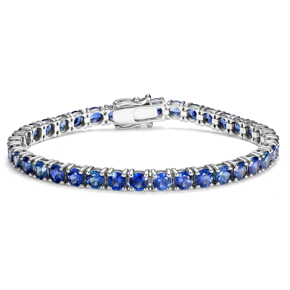 White gold tennis bracelet set with vivid blue sapphires